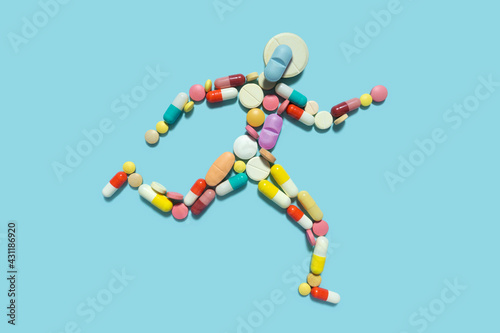 Creative medicine health sport concept photo of man person made of pills drugs running for doping. photo