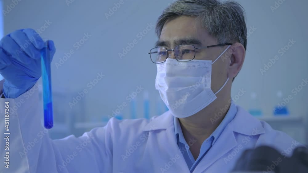 Research concept of 4k resolution. Asian scientists are comparing laboratory solutions. Research concept of 4k resolution. Asian scientists are comparing laboratory solutions.