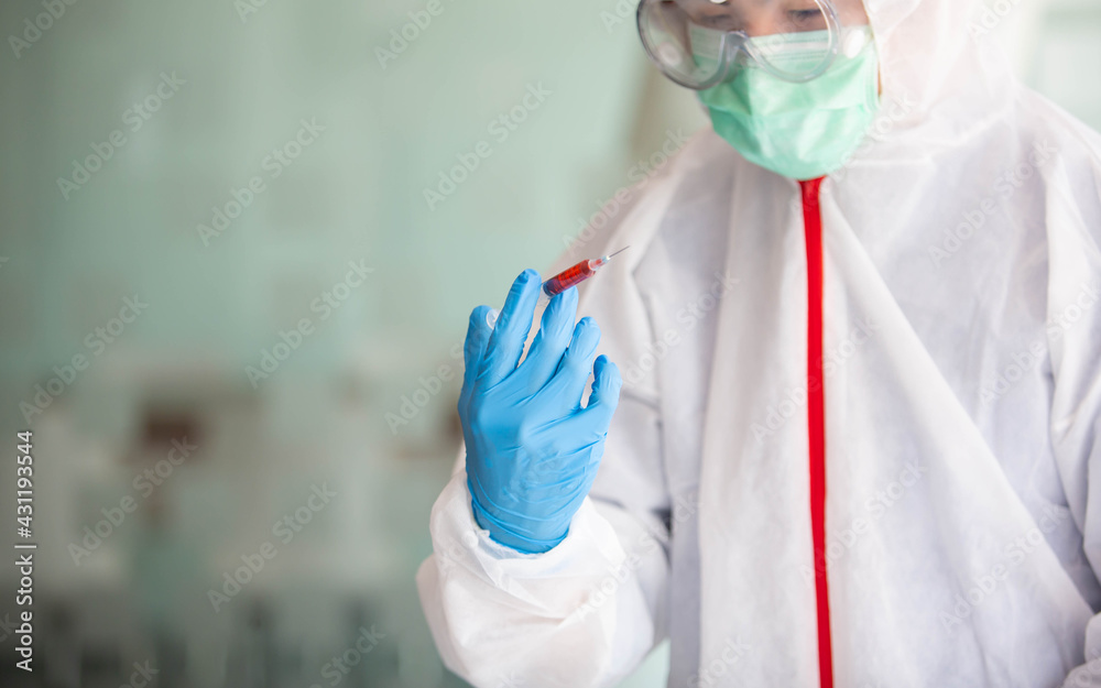 Fototapeta premium The doctor is testing a sample of biological tubes contaminated by Corona-virus Covid 19 and searching for a vaccine or Syrup against the virus. In the laboratory and film samples of infected lung