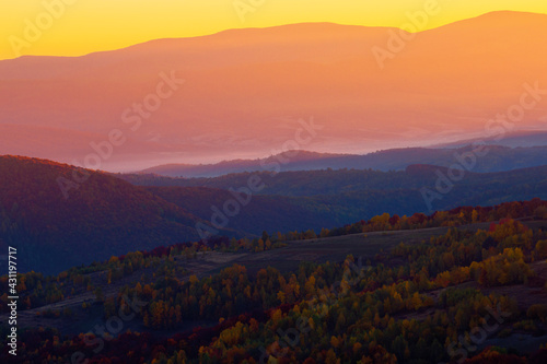thick fog over the rural hills in morning light. dramatic Carpathian countryside autumnal scenery © Pellinni