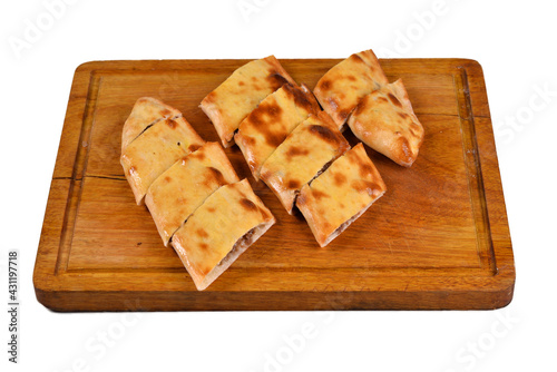 Traditional Turkish Cuisine food cheese pita (pide) with cheddar cheese and braised meat. Turkish cuisine. Turkish pizza Pita (kavurmali kasarli pide) on wood, on white background close up