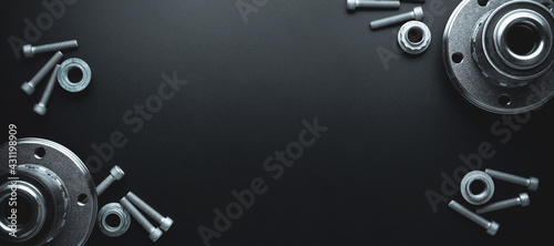 Engine gears. Auto motor mechanic spare or automotive piece on dark banner background. Set of new metal car part. Flat lay, top view, copy space.