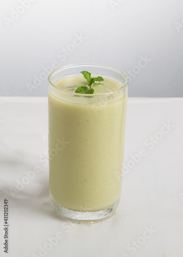 glass of borhani yogurt with mint