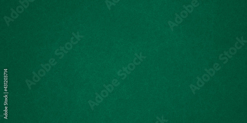 Elegant dark emerald green background with black shadow border and old vintage grunge texture design 