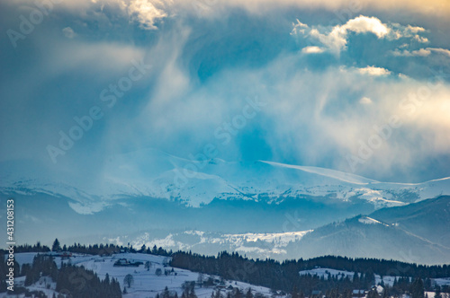 Clouds over the mountains on a winter evening