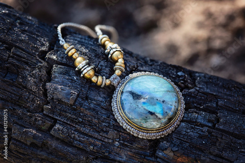 Natural mineral labradorite stone jewelry necklace on natural background