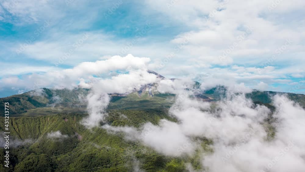 Hyperlapse of reventador Amazonic Andean volcano eruption in Ecuador with a drone aerial video with jungle and dense clouds Hyperlapse of reventador Amazonic Andean volcano eruption in Ecuador with a drone aerial video with jungle and dense clouds
