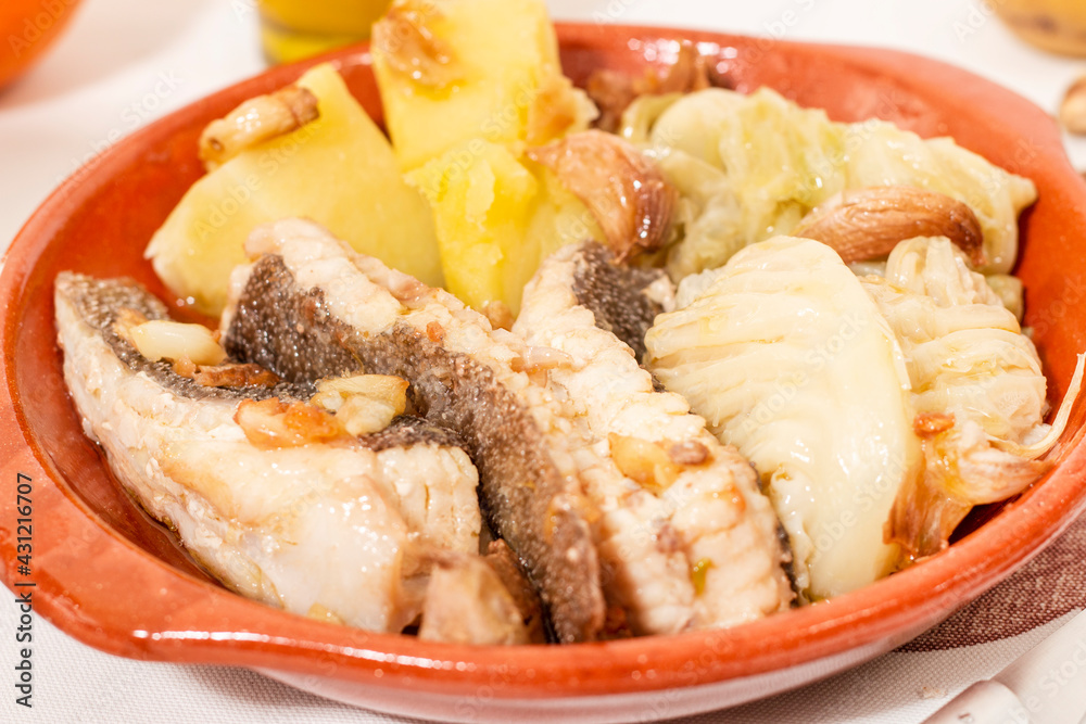 Homemade ray fish with potatos and garlic Homemade ray fish with potatos and garlic