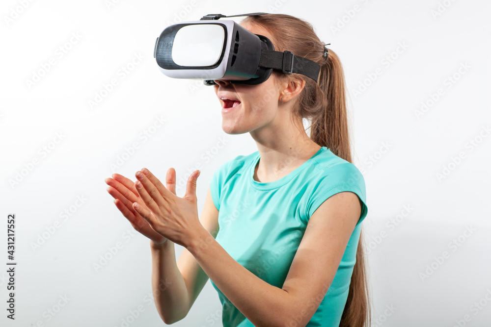 Girl in virtual reality glasses watching surprised shocking video. Young woman looking at futuristic social network map concept Girl in virtual reality glasses watching surprised shocking video. Young woman looking at futuristic social network map concept