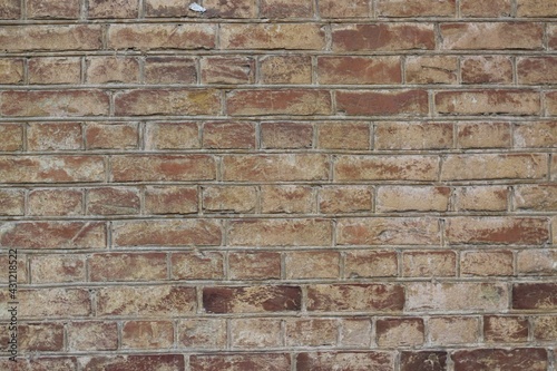  the wall of an old brick house