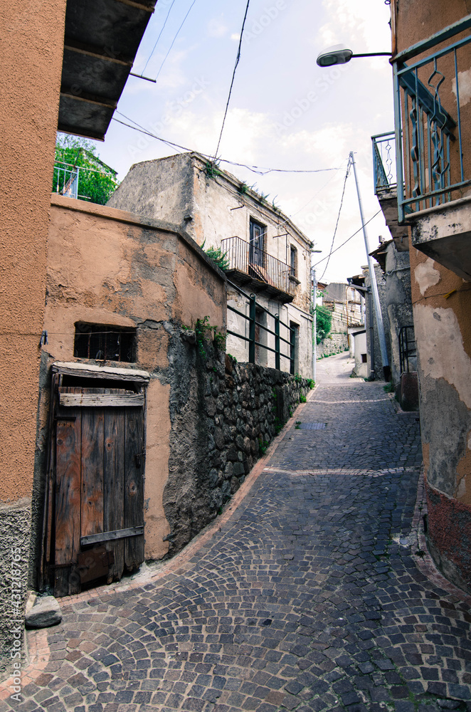 Narrow street in old town of Calabria, Italy