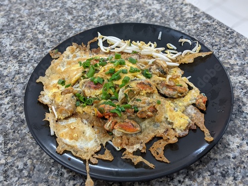 Fried clams with eggs on a plate