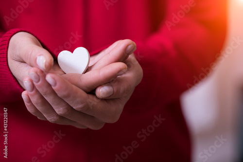 hands holding white heart. Valentines day. Love photo. Romantic. 