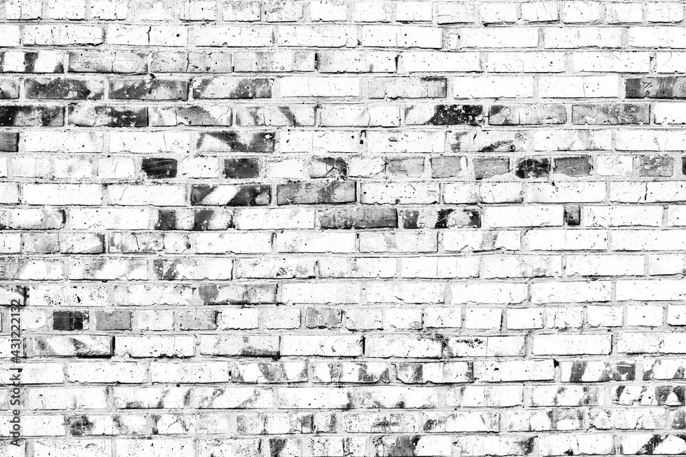 Fototapeta premium Texture of a brick wall with cracks and scratches which can be used as a background