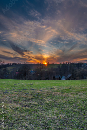 Sunset view in Roprachtice village in Krkonose mountains with color sky
