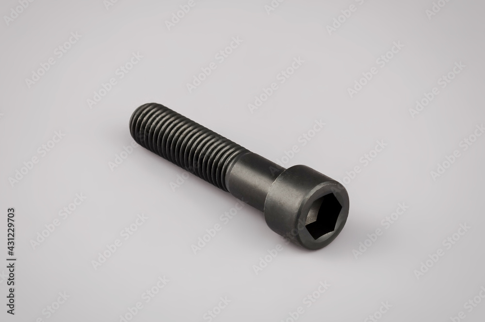 Mounting bolt under the hexagon on a gray background. Car mounting bolt. Mounting element .New bolt. Bolt. Torx mounting bolt Mounting bolt under the hexagon on a gray background. Car mounting bolt. Mounting element .New bolt. Bolt. Torx mounting bolt