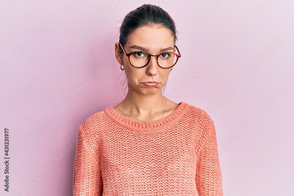 Young caucasian woman wearing casual clothes and glasses depressed and worry for distress, crying angry and afraid. sad expression. Young caucasian woman wearing casual clothes and glasses depressed and worry for distress, crying angry and afraid. sad expression.