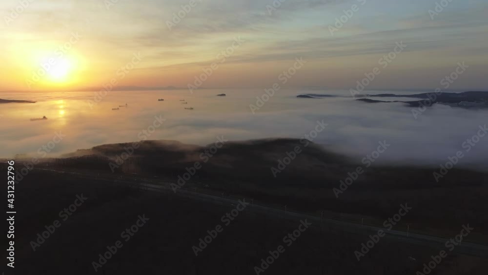 Drone view of the bay with ships in the fog Drone view of the bay with ships in the fog