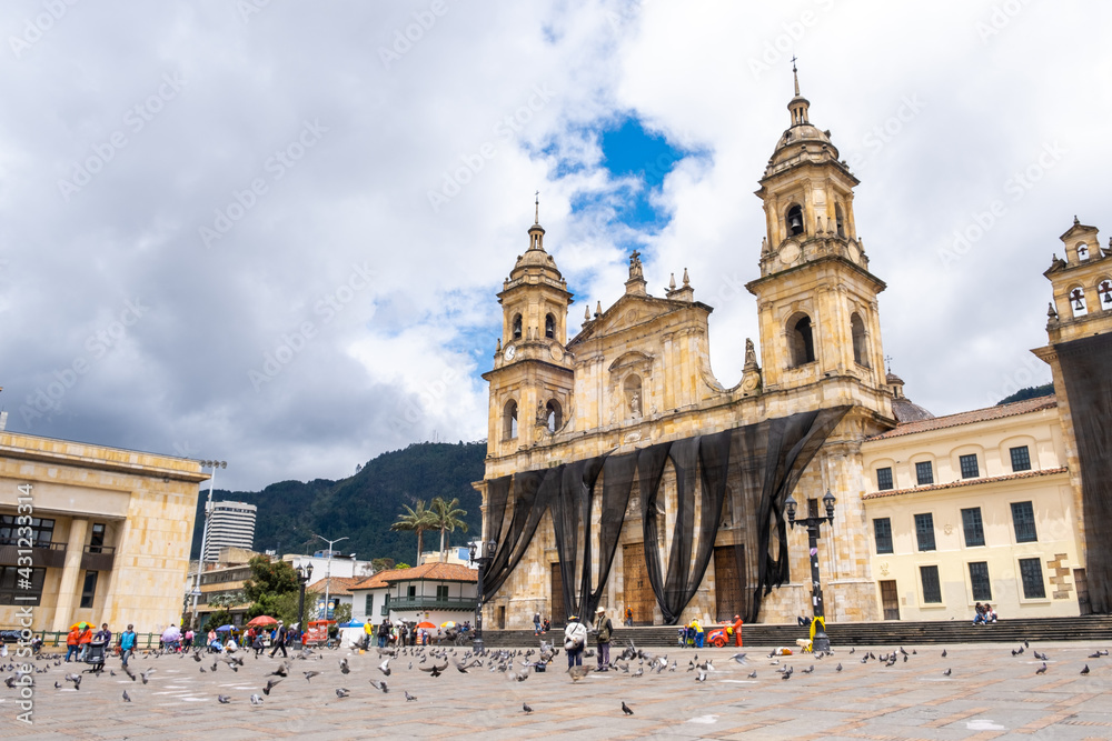 BOGOTA, COLOMBIA - March 20, 2021: Plaza De Bolivar main square of Bogota with the Metropolitan Cathedral Basilica of the Immaculate Conception