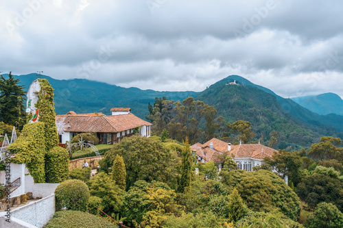 Visitors take in breathtaking views of Bogota on a spring day in Mount Monserrate. Colombia, skyscrapers