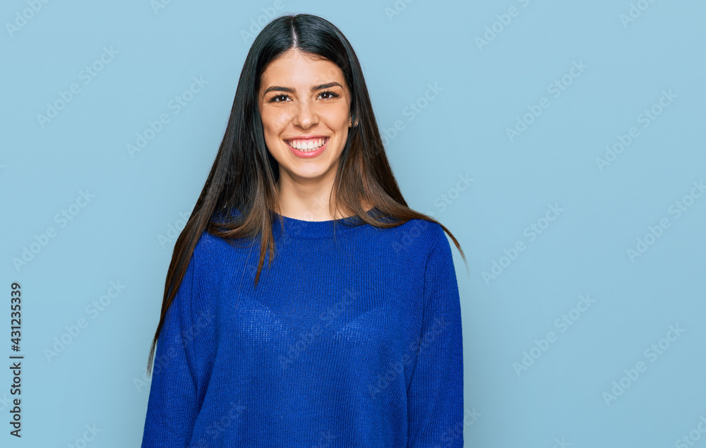 Young hispanic woman wearing casual clothes with a happy and cool smile on face. lucky person. Young hispanic woman wearing casual clothes with a happy and cool smile on face. lucky person.