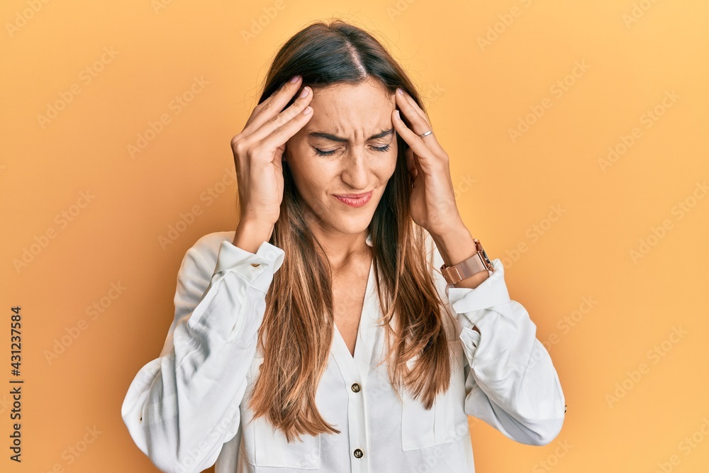 Young beautiful woman wearing casual clothes with hand on head, headache because stress. suffering migraine.