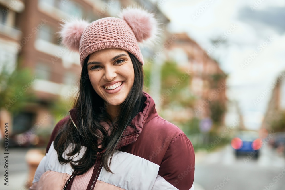 Young hispanic girl smiling happy standing at the city. Young hispanic girl smiling happy standing at the city.