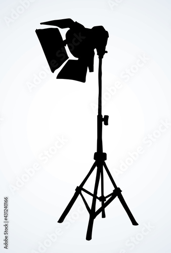 Spotlight on a stand. Vector drawing