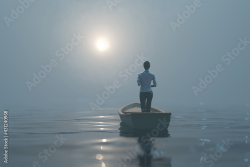 woman sailing in a boat in the fog 