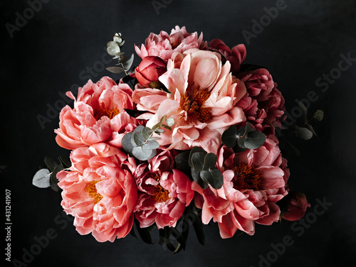 Fototapeta Naklejka Na Ścianę i Meble -  Pink peonies over dark background. Moody floral baroque style image