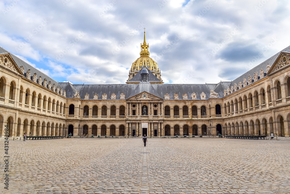 Musee de l'Armee, Hotel National des Invalides with a woman walking in, in Paris, isometric front view with blue sky and lots of clouds with multiple color tones