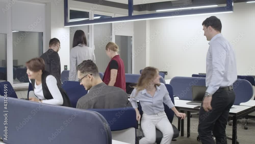Wide shot of cheerful men and women stacking hands rejoicing business success in office indoors. Positive successful Caucasian colleagues coworkers smiling. Organization and teamwork Wide shot of cheerful men and women stacking hands rejoicing business success in office indoors. Positive successful Caucasian colleagues coworkers smiling. Organization and teamwork