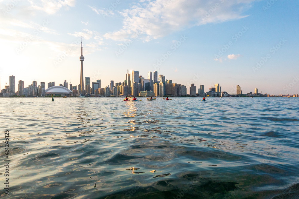 Sea kayakers leave the Toronto Islands heading back toward downtown Toronto and the CN Tower.