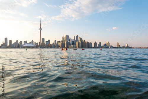 Sea kayakers leave the Toronto Islands heading back toward downtown Toronto and the CN Tower.