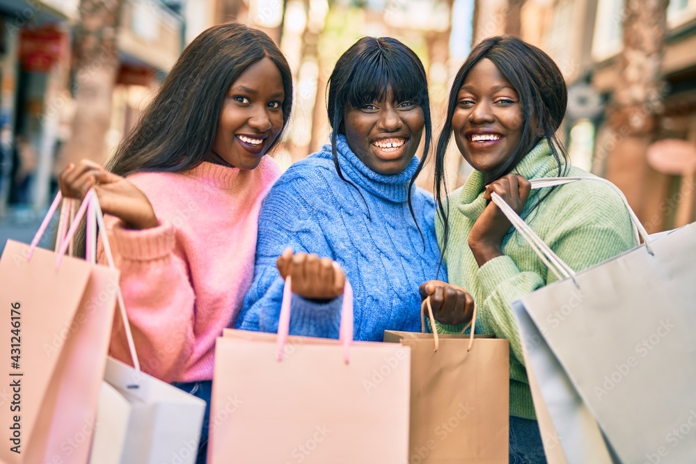 Three african american friends going shopping at the city. Three african american friends going shopping at the city.