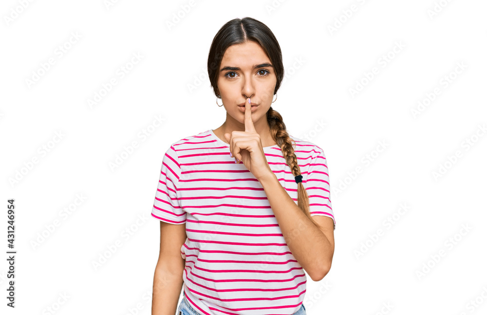 Young hispanic woman wearing casual clothes asking to be quiet with finger on lips. silence and secret concept. Young hispanic woman wearing casual clothes asking to be quiet with finger on lips. silence and secret concept.