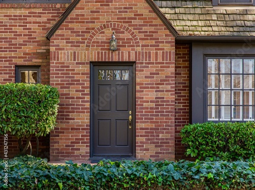Konstfotografi brick house with a front door