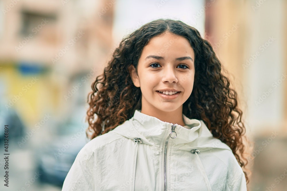 Hispanic teenager girl smiling happy standing at the city. Hispanic teenager girl smiling happy standing at the city.