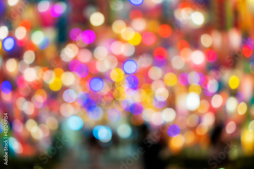 Abstract decoration color circle sparkle light blur bokeh background for celebration festive. Shiny glowing blurry bright in the night. © kaew6566
