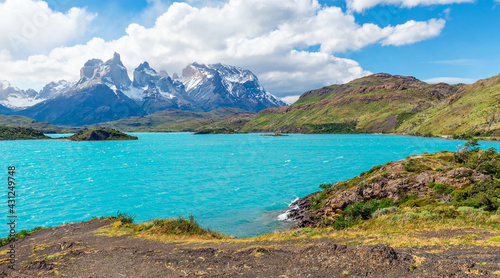 Fototapeta Naklejka Na Ścianę i Meble -  Pehoe Lake panorama with Cuernos del Paine and copy space, Torres del Paine national park, Patagonia, Chile.