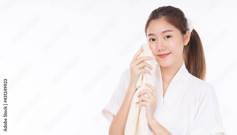 Beauty, cosmetics, healthy, treatment, skincare and spa concept. Asian young woman using white towel clean own face clear fresh skin. Teenager removing makeup off skin over isolated white background. Beauty, cosmetics, healthy, treatment, skincare and spa concept. Asian young woman using white towel clean own face clear fresh skin. Teenager removing makeup off skin over isolated white background.