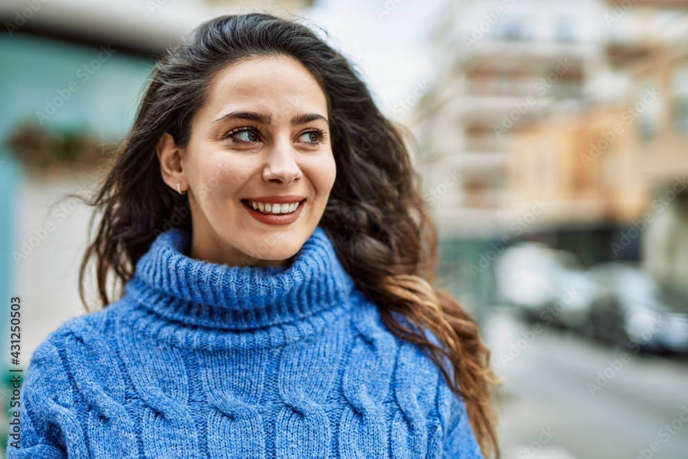Young hispanic woman smiling happy standing at the city. Young hispanic woman smiling happy standing at the city.