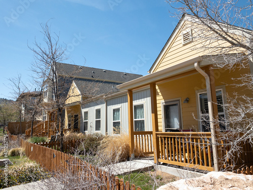 Regular street scene without people in a housing area with multiple units including condo or townhouse with balcony or veranda without people in Boulder, Colorado