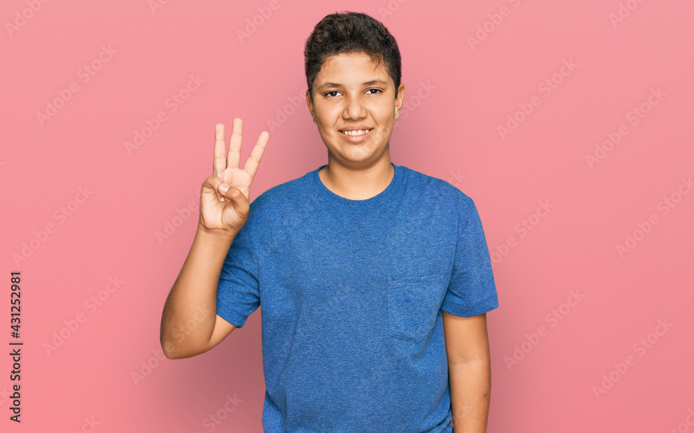Teenager hispanic boy wearing casual clothes showing and pointing up with fingers number three while smiling confident and happy. Teenager hispanic boy wearing casual clothes showing and pointing up with fingers number three while smiling confident and happy.