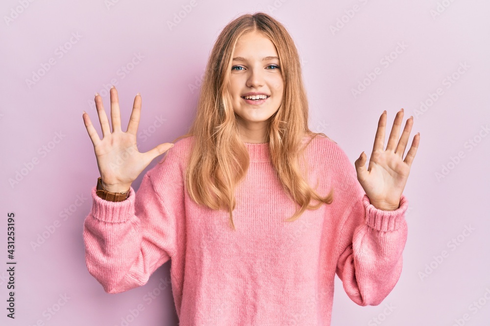Beautiful young caucasian girl wearing casual clothes showing and pointing up with fingers number ten while smiling confident and happy. Beautiful young caucasian girl wearing casual clothes showing and pointing up with fingers number ten while smiling confident and happy.