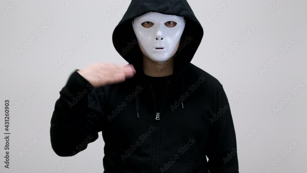 Hacker with anonymous mask showing gesture of Hacker with anonymous mask showing gesture of