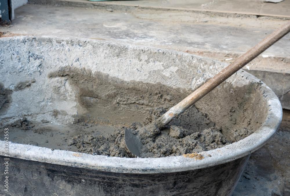 Cement powderand water mix in plastic mix blow with hoe Cement powderand water mix in plastic mix blow with hoe