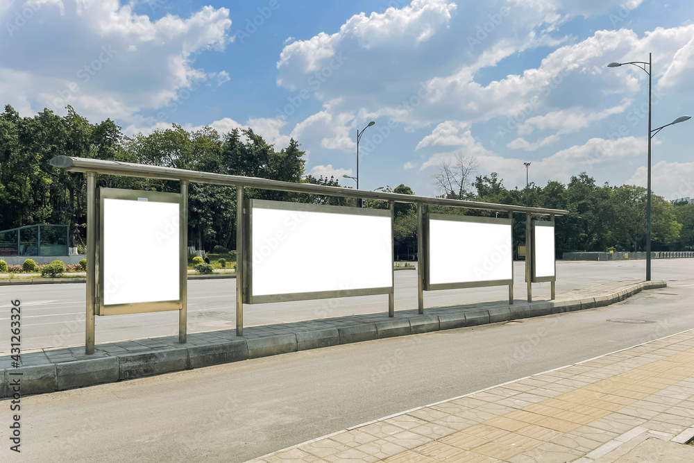 Blank billboard in a bus stop, in urban environment Blank billboard in a bus stop, in urban environment