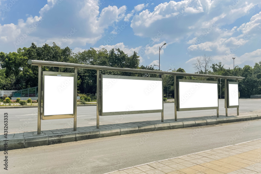 Blank billboard in a bus stop, in urban environment Blank billboard in a bus stop, in urban environment