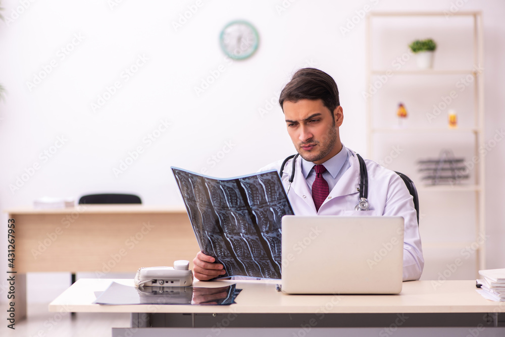 Young male doctor radiologist working in the clinic Young male doctor radiologist working in the clinic